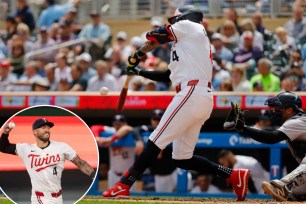 Jamil Douglas, a baseball player, in action swinging a bat