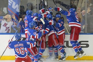 Rangers celebrate after Vincent Trocheck scored the game-winning goal in double overtime to lead the Rangers to a 4-3 win over the Hurricanes in Game 2.
