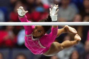 Simone Biles competes on the uneven bars during the U.S. Classic.