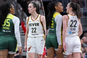 Seattle Storm guard Victoria Vivians, left, and Indiana Fever guard Caitlin Clark (22) exchange words after making contact with one another during the first half of a WNBA basketball game Thursday, May 30, 2024, in Indianapolis. 