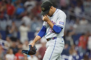 Edwin Diaz wallks off the mound after getting pulled in the ninth inning of the Mets' 10-9, 10-inning loss to the Marlins.