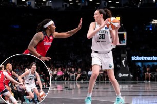 Basketball player Breanna Stewart playing basketball with another woman