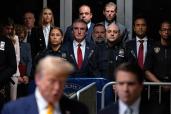 Supporters of former President Donald Trump listen as Trump speaks after court proceedings ended for the day in his trial at Manhattan criminal court, Tuesday, May 14, 2024.