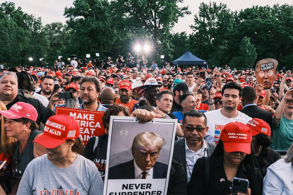 People attend a campaign rally for former US president Donald Trump in Cortona Park in the Bronx