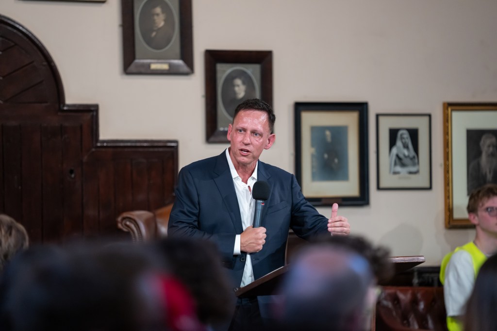 Peter Thiel, the billionaire tech investor and co-founder of Palantir, is seen above at Cambridge Union in the UK on Wednesday.