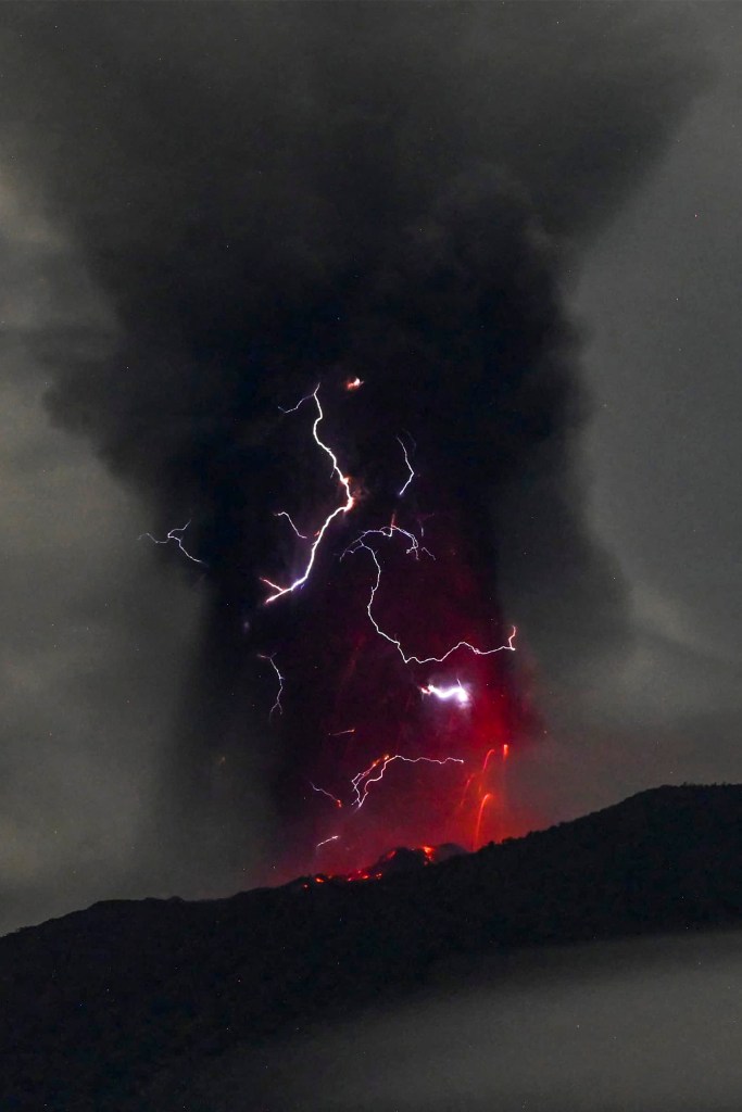 Mount Ibu spewing volcanic ash as lightning strikes