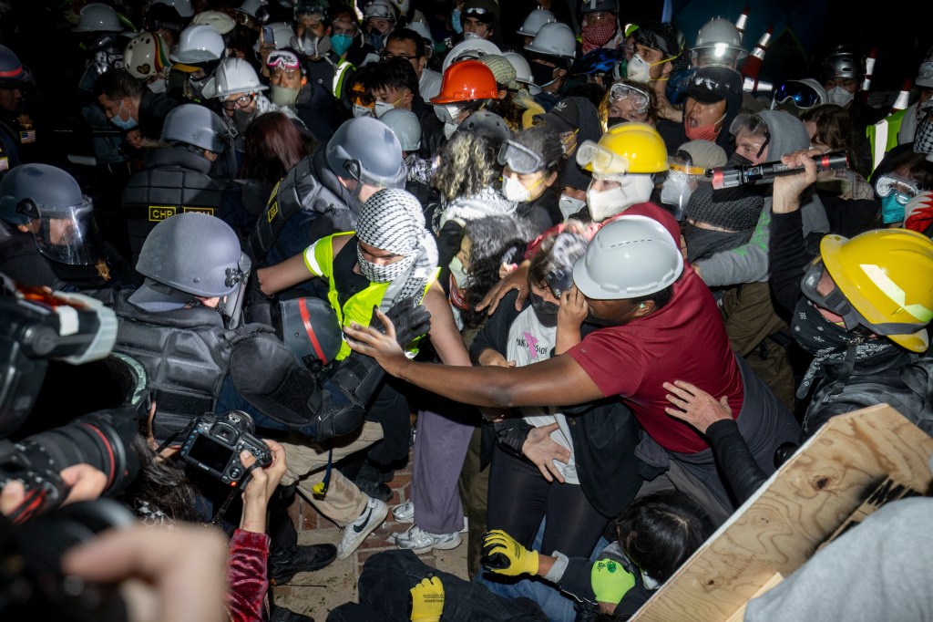 Police advance on pro-Palestinian demonstrators on the UCLA campus Thursday, May 2, 2024, in Los Angeles.