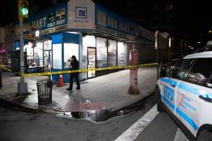 Police are seen at the scene of a fatal stabbing on Queens Blvd. in Queens, Tuesday, May 7, 2024. The stabbing happened in the bodega at 97-02 Queens Blvd. with a blood trail to 97-50 Queens Blvd. where the victim collapsed.