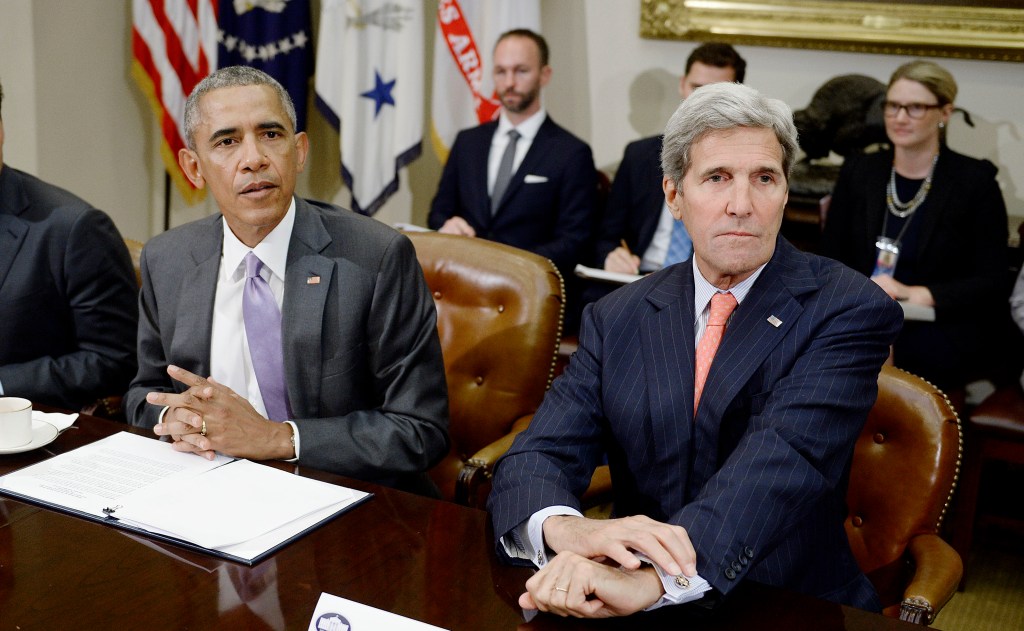 U.S President Barack Obama and Secretary of State John Kerry(R) meet with a small group of veterans and Gold Star Mothers to discuss the Iran Nuclear deal in the Roosevelt Room of the White House in Washington, DC, September 10, 2015.