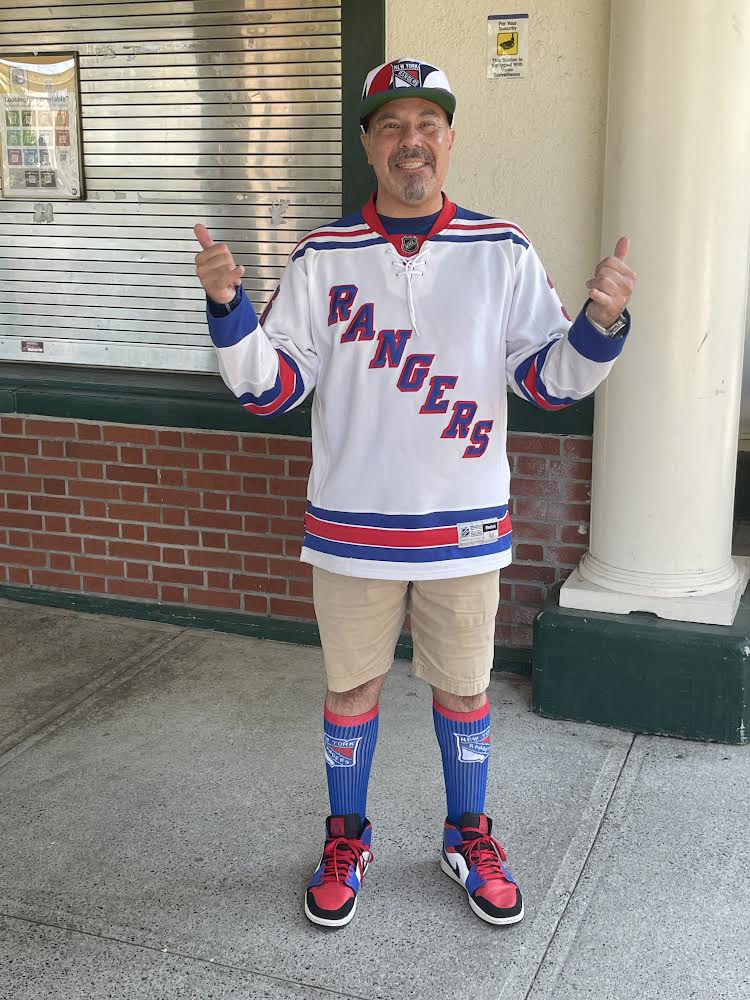 Rangers fan Ed Goldberg is decked out in Rangers gear.