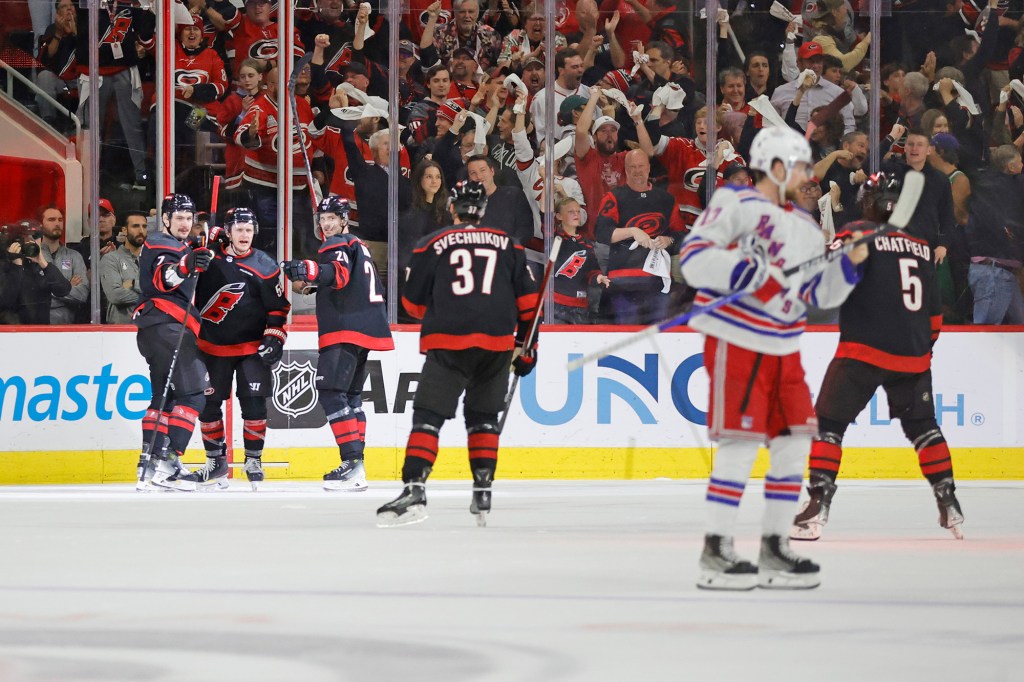 The Hurricanes celebrate Jake Guentzel's goal during the first period of Game 3.