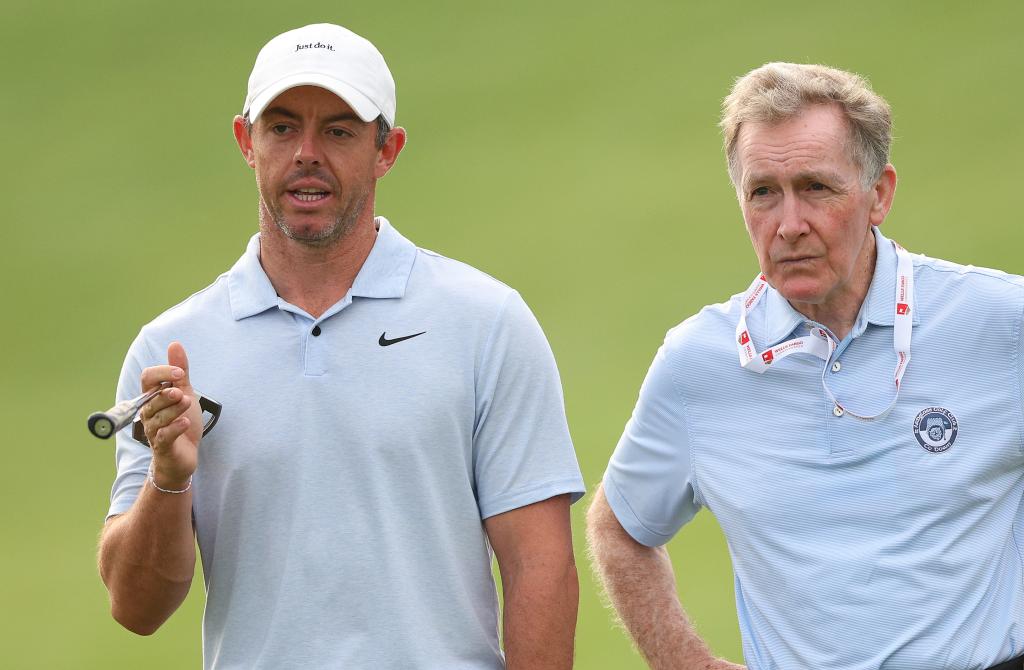 Rory McIlroy and his coach Michael Bannon standing on a golf course at Quail Hollow Country Club during the Pro Am event, May 2024.