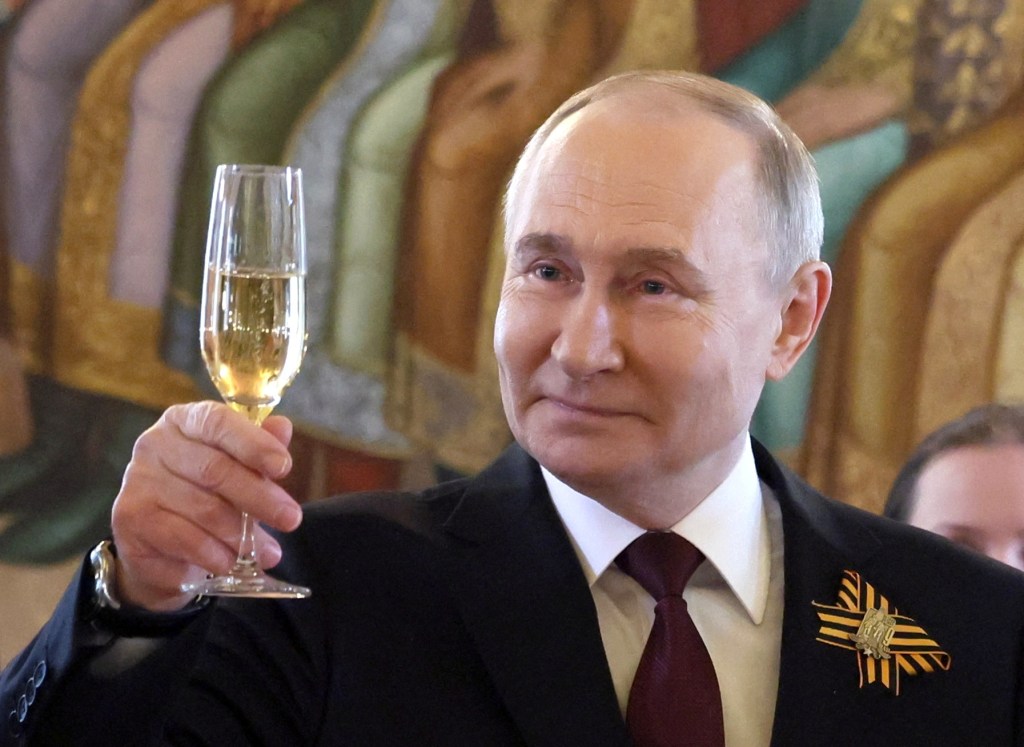 Russian President Vladimir Putin toasting with a champagne glass during Victory Day reception marking the 79th anniversary of WWII victory in Moscow