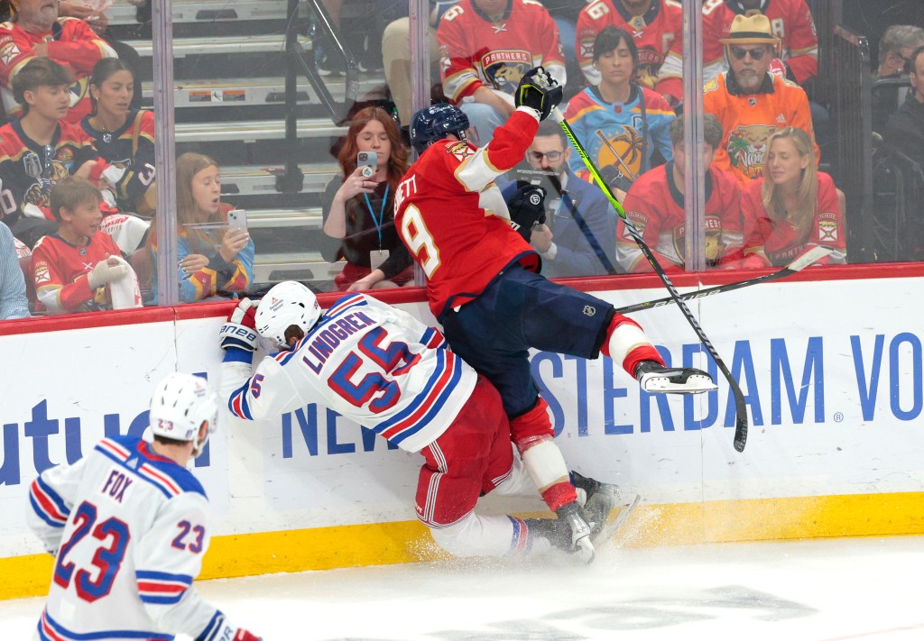 Sam Bennett of the Panthers (9) hits Rangers defenseman Ryan Lindgren (55) during Game 3 of the Eastern Conference Final on Sunday.