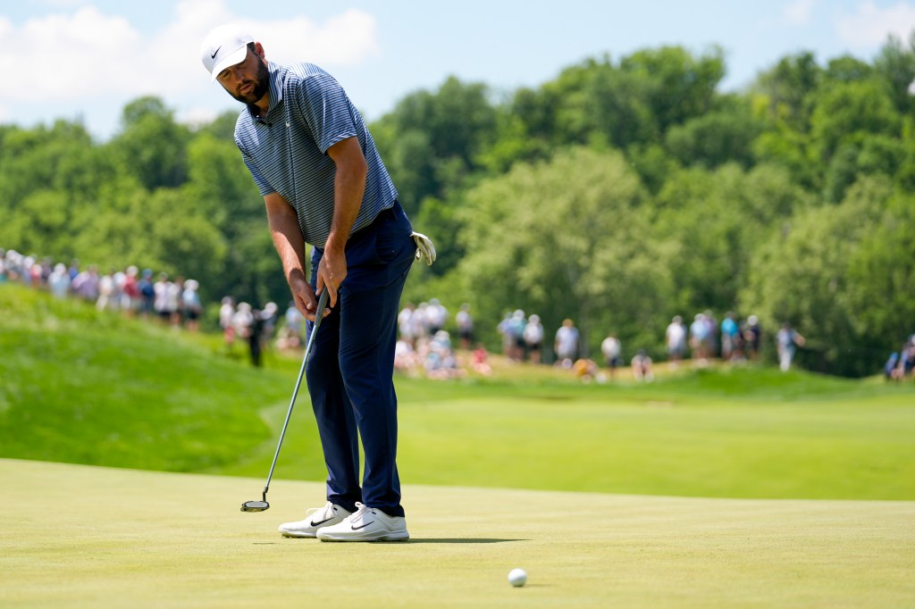 Scottie Scheffler reacts after missing a putt on the fourth hole during the final round of the PGA Championship.