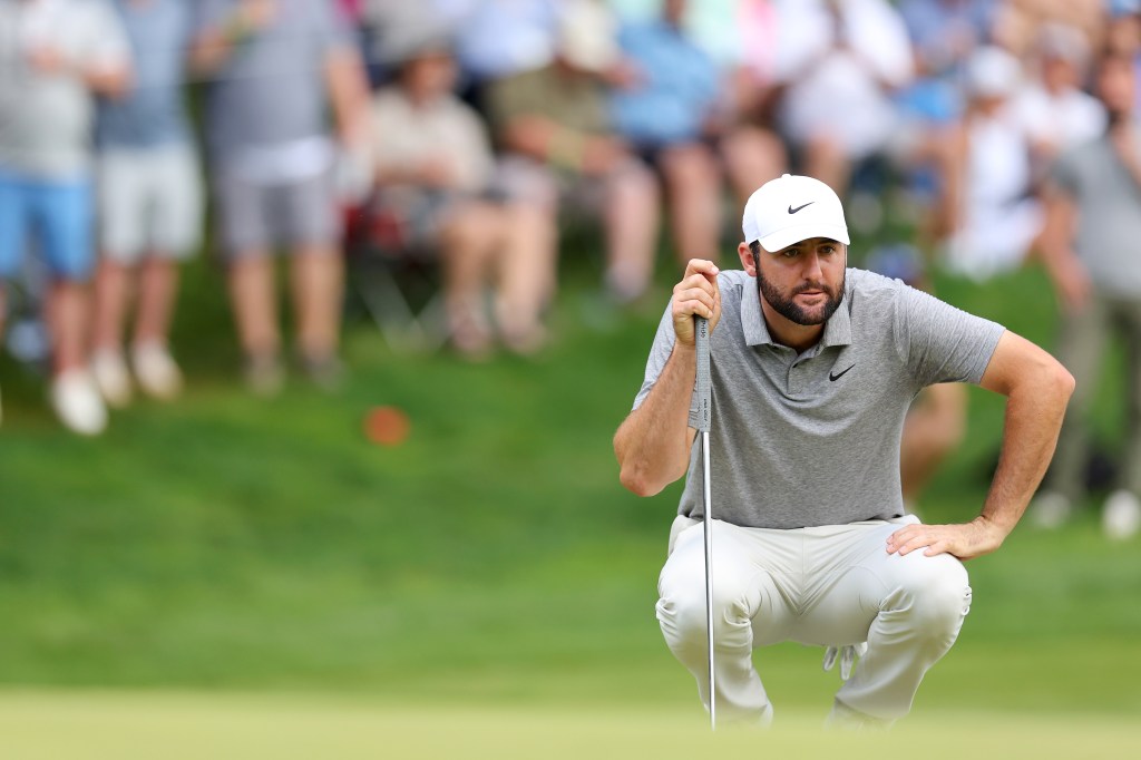 Scottie Scheffler lines up a putt on the sixth green during the third  round of the 2024 PGA Championship on Saturday.