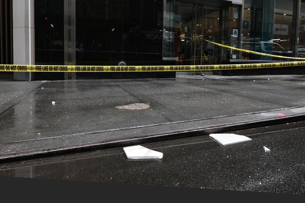 Shards of tile blown off a building on a sidewalk in Manhattan.