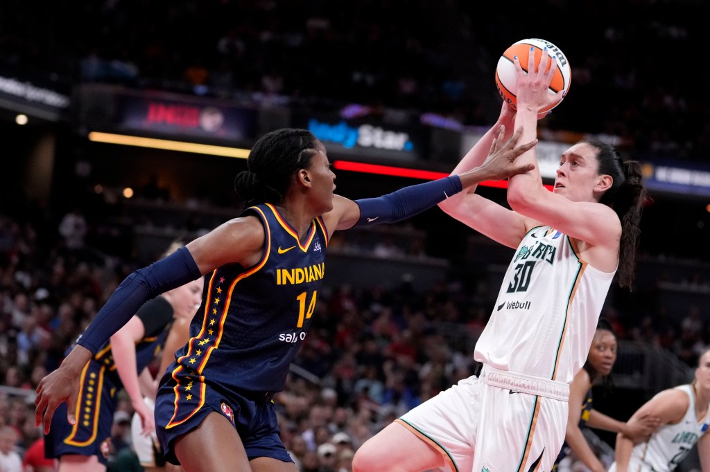 Liberty forward Breanna Stewart (30) shoots over Indiana Fever center Temi Fagbenle (14) in the first half