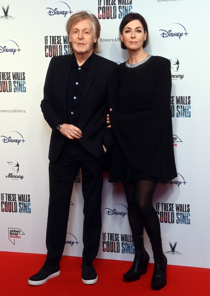 Sir Paul McCartney and his daughter, Mary McCartney, standing together at the 'If These Walls Could Sing' documentary premiere in London, 2022