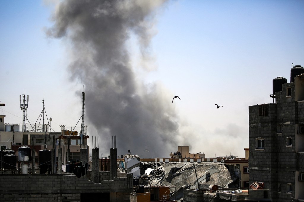 Smoke billows over Rafah following an Israeli airstrike on Thursday.