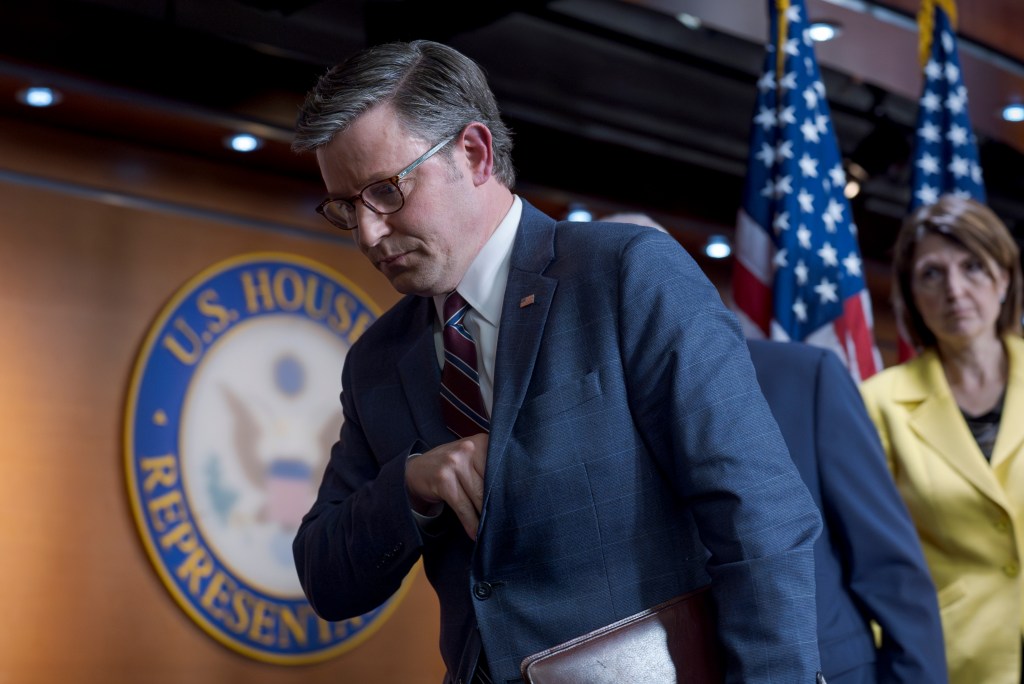 Speaker of the House Mike Johnson, in suit and tie, departing the Capitol in Washington after discussing Republican responses to student protests