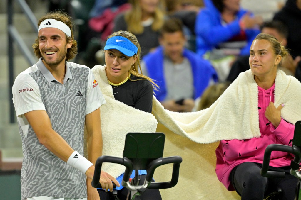 (From left) Stefanos Tsitsipas, Paula Badosa and Aryna Sabalenka watch action in the Eisenhower Cup Tie Break Tens event featuring mixed doubles during the BNP Paribas Open at the Indian Wells in March 2024.