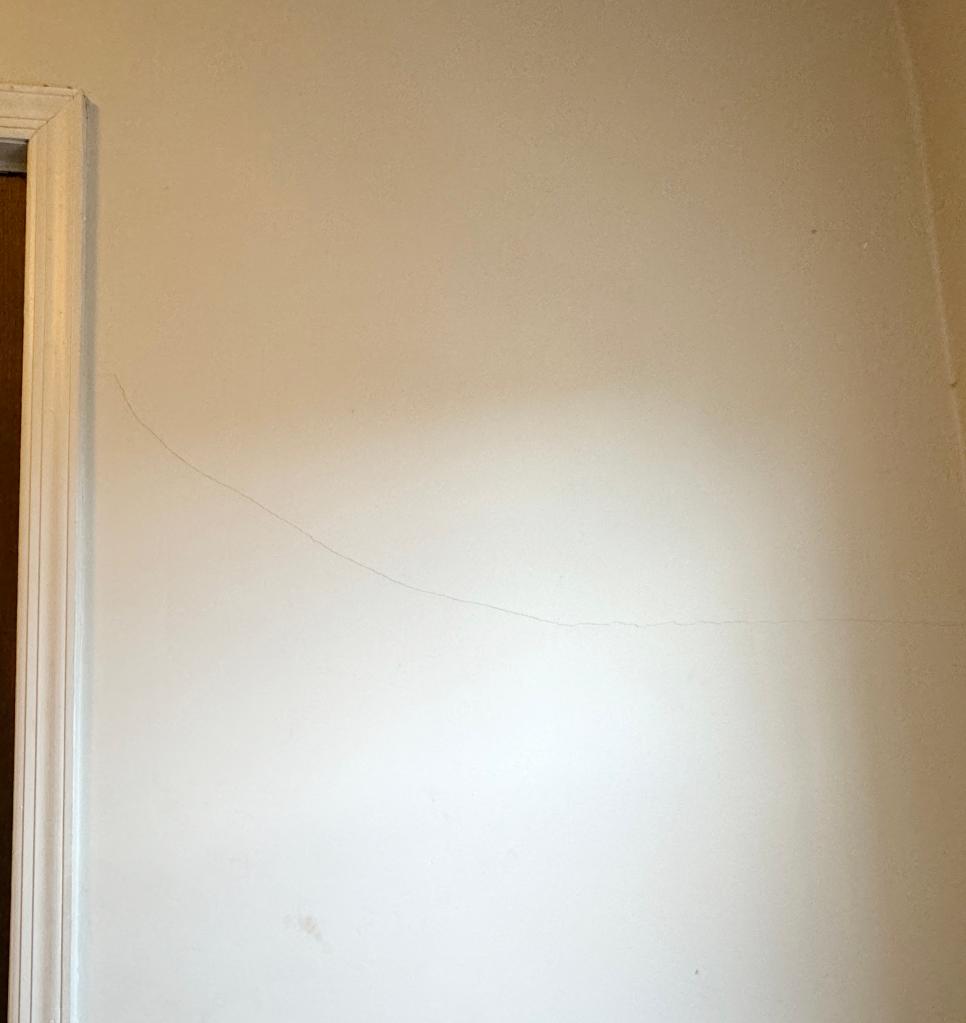 hairline crack seen going horizontally across wall from doorframe to other wall