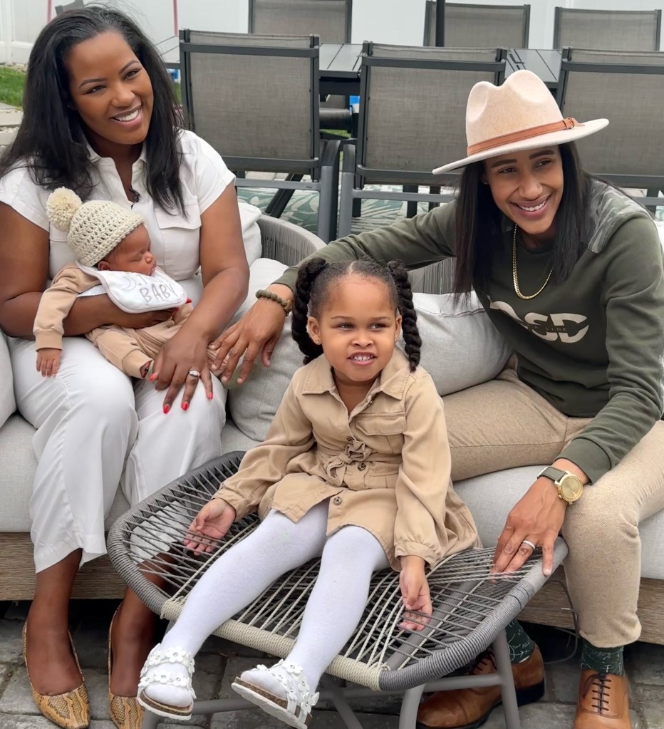 Tamiah Brevard-Rodriguez poses with wife Alyza Brevard-Rodriguez, the couple's four-year-old daughter, Aubriel, and their new baby boy, Enzo. 