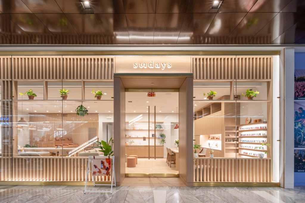 A store front with glass doors at Sundays Hudson Yards