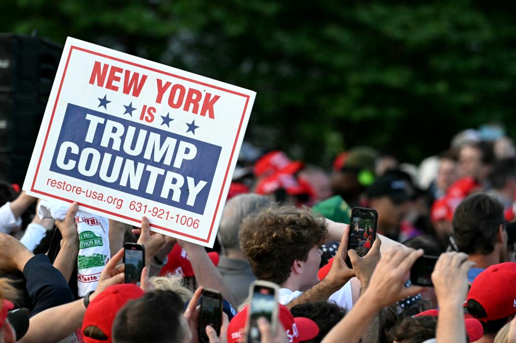 Supporters of former US President and Republican presidential candidate Donald Trump attend a campaign rally in the South Bronx in New York City on May 23, 2024