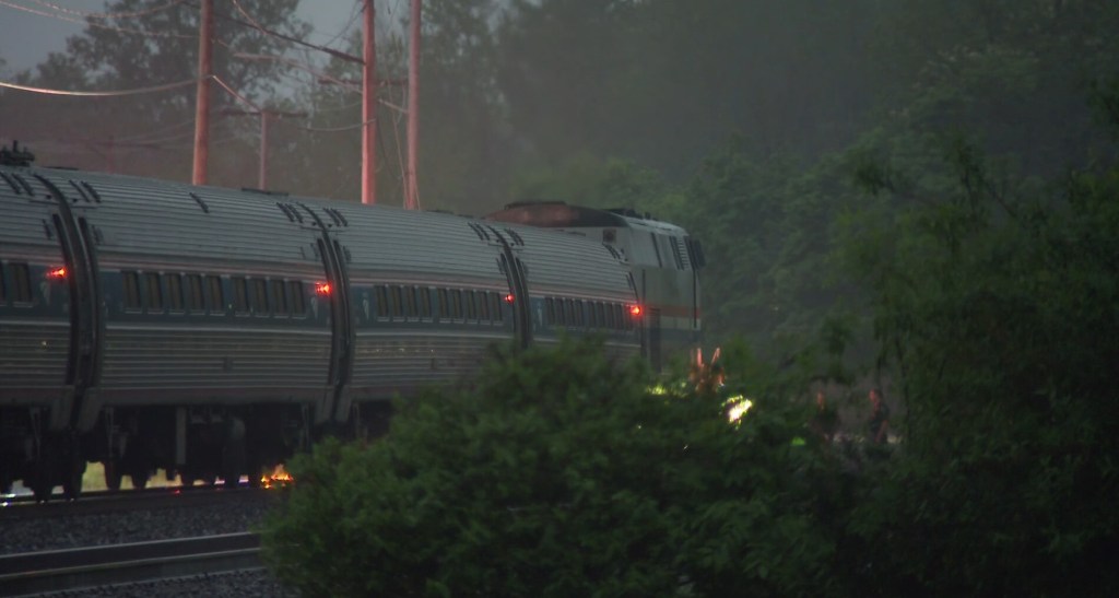 According to witnesses, the truck was lodged between the gate and railroad crossing.