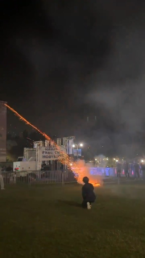 A firework is set off during the chaos at UCLA.