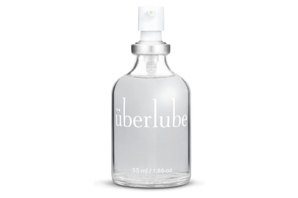 A clear bottle with a white cap labeled 'Uberlube'