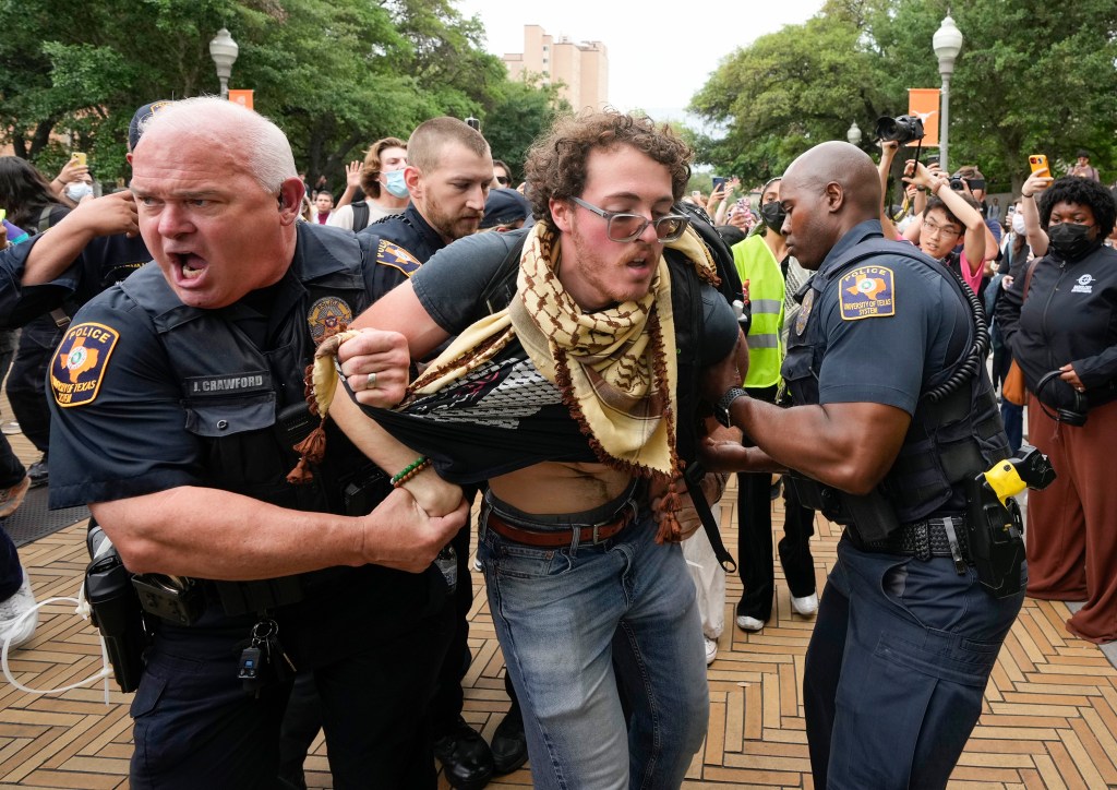 University of Texas police officers arrest a man at a pro-Palestinian protest on campus, Wednesday April 24, 2024, in Austin, Texas.