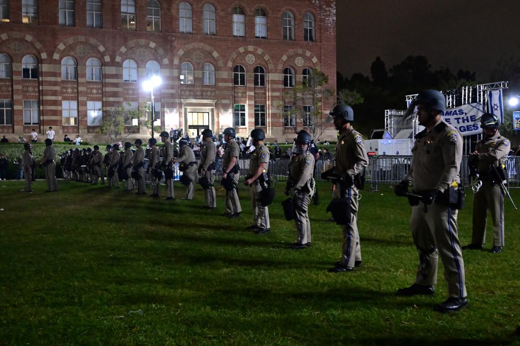 A line of officers arrived to separate the two groups and restore peace.