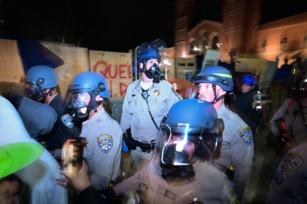 Police were called to quell the chaos that broke out overnight after the university said the encampment violated school policy.