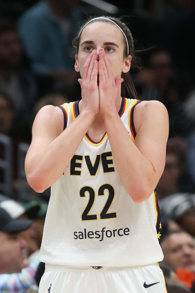 Caitlin Clark #22 of the Indiana Fever reacting during a basketball game against the Seattle Storm