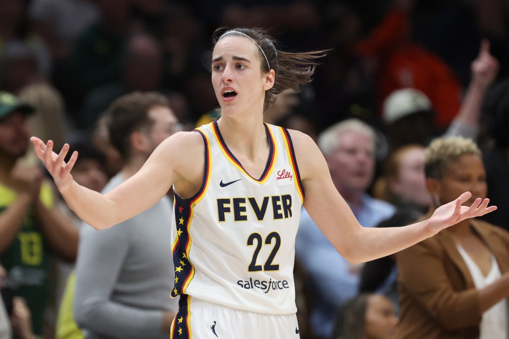 Caitlin Clark #22 of the Indiana Fever reacts during the fourth quarter against the Seattle Storm in the game at Climate Pledge Arena on May 22, 2024 in Seattle, Washington.  