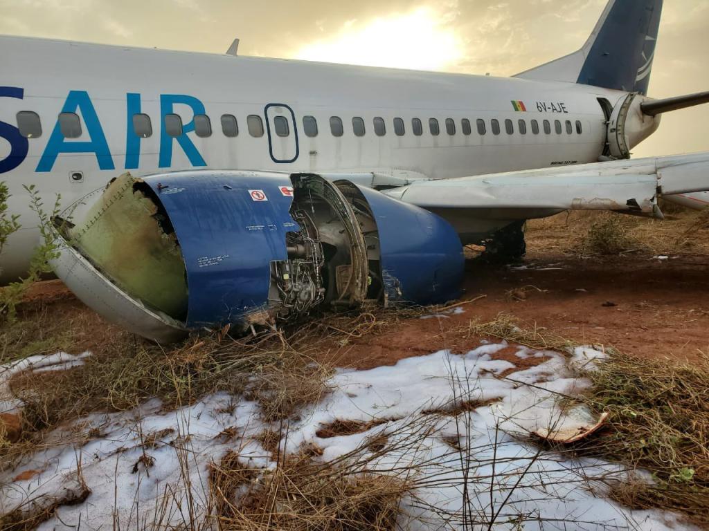 The plane had a large hole in the left engine, photos from the scene revealed.