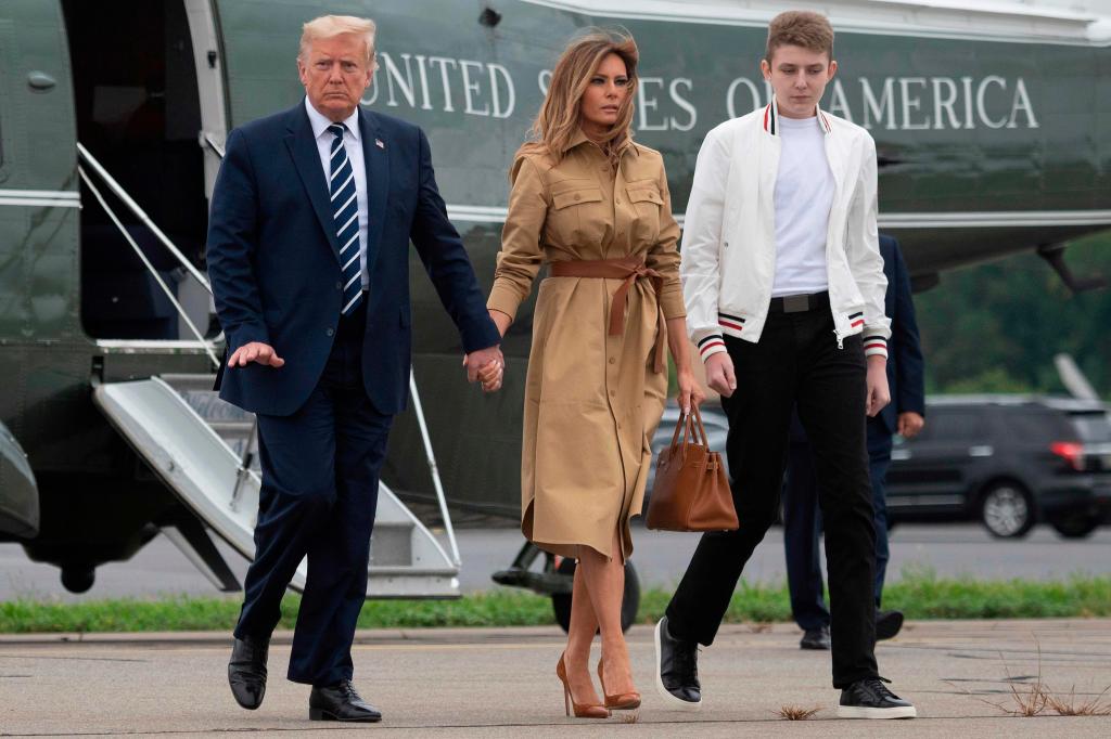President Trump, Melania Trump and Barron Trump step off of Marine One at Morristown Municipal Airport in New Jersey on Aug. 16, 2020.