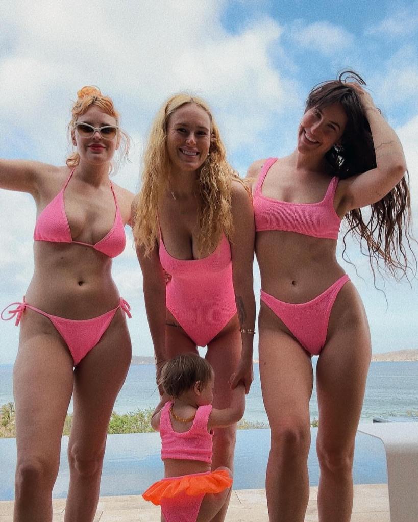 Demi Moore's daughters, Rumer and Scout Willis, alongside Rumer's daughter Louetta, wearing matching pink bathing suits