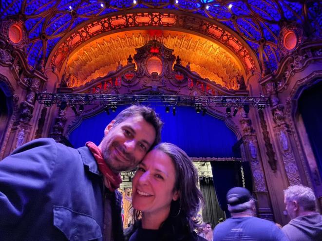 A couple poses for a selfie beneath the baroque ceiling at the Brooklyn Paramount historic theater.