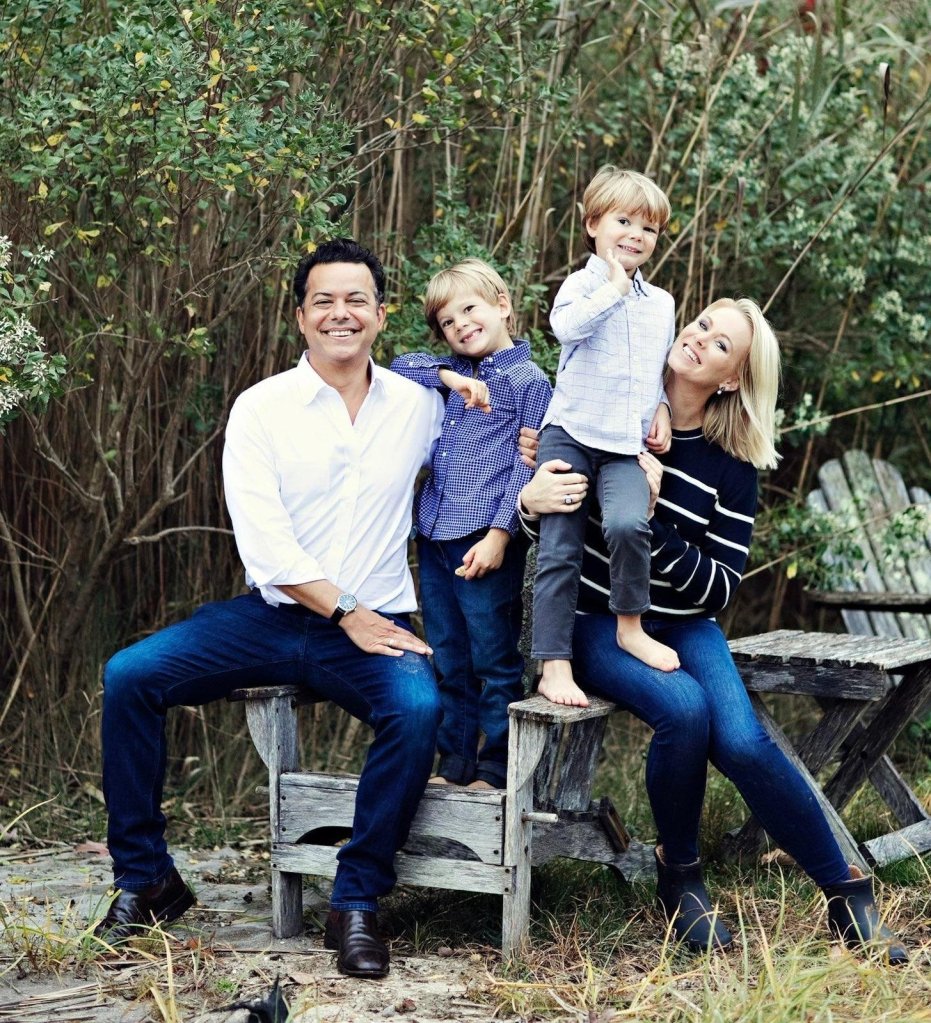 John Avlon with Margaret Hoover and their children sitting on a bench