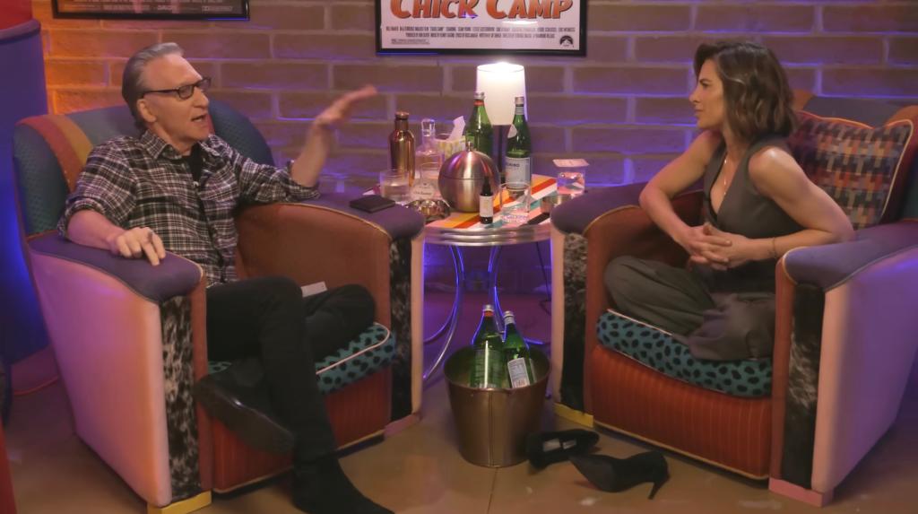 Bill Maher and Jillian Michaels sitting in chairs during a Club Random podcast episode.