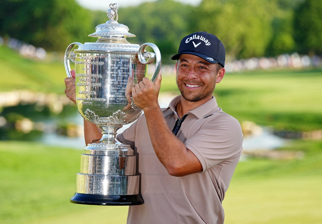 Xander Schauffele holds The Wanamaker Trophy after winning the PGA Championship golf tournament at Valhalla Golf Club in Louisville, Kentucky May 19, 2024. 