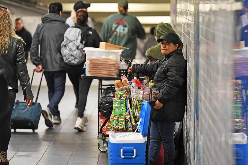 Woman selling candy/food on the city's subway system. 