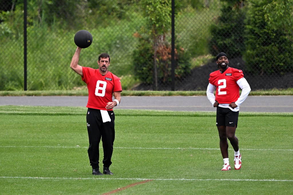Jets quarterback Aaron Rodgers works out with a medicine ball during OTAs in Florham Park, NJ. 