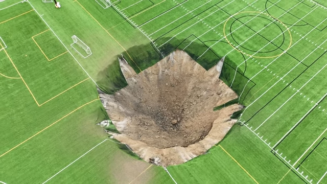 A park in Alton, Illinois, closed on Wednesday, June 26, after a giant sinkhole opened up in the middle of a soccer field.
Footage captured by 618 Drone Service shows the large hole, estimated to be around 100 feet wide in the turf at Gordon Moore Park.