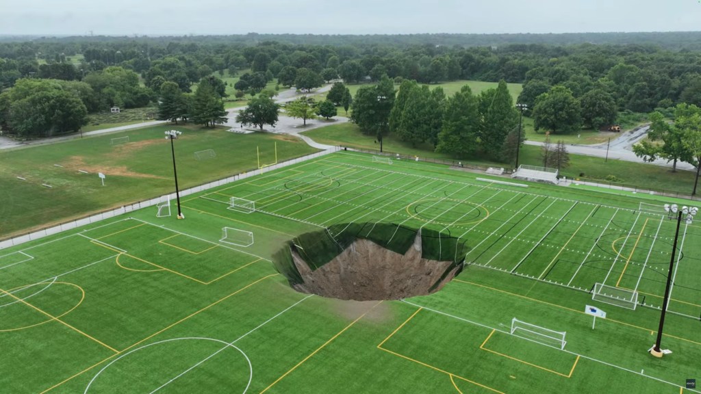 A park in Alton, Illinois, closed on Wednesday, June 26, after a giant sinkhole opened up in the middle of a soccer field.
Footage captured by 618 Drone Service shows the large hole, estimated to be around 100 feet wide in the turf at Gordon Moore Park.