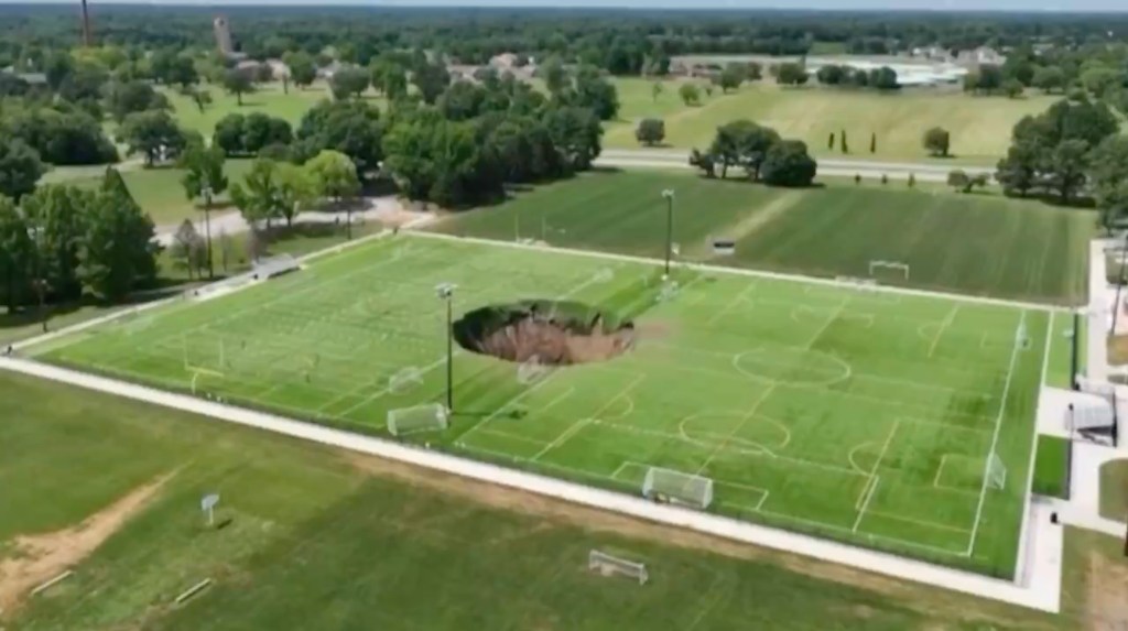 A park in Alton, Illinois, closed on Wednesday, June 26, after a giant sinkhole opened up in the middle of a soccer field.
Footage captured by 618 Drone Service shows the large hole, estimated to be around 100 feet wide in the turf at Gordon Moore Park.